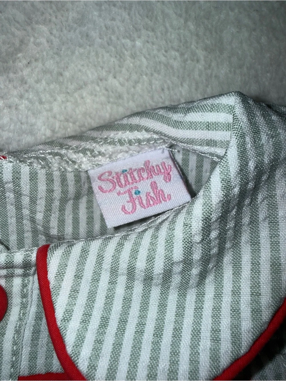 Stitchy Fish green seersucker bubble with red button accents, size 9 mo